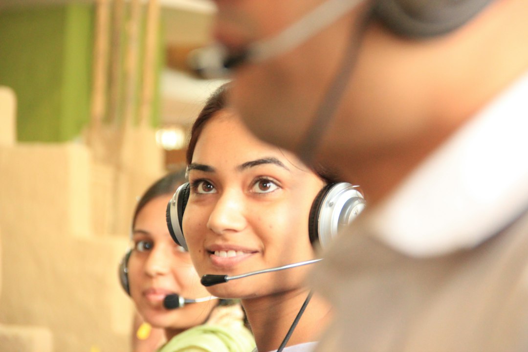 Two customer support specialists ready to help